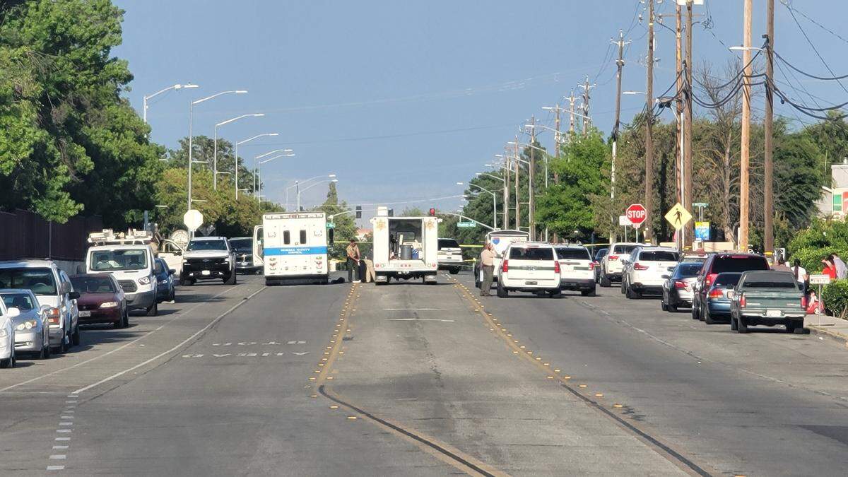 Fresno County sheriff’s cars and other emergency vehicles were at the scene of a drive-by shooting along East Parlier Avenue in Parlier after one man was killed and another injured Sunday, May 2, 2021, in Fresno County, California.