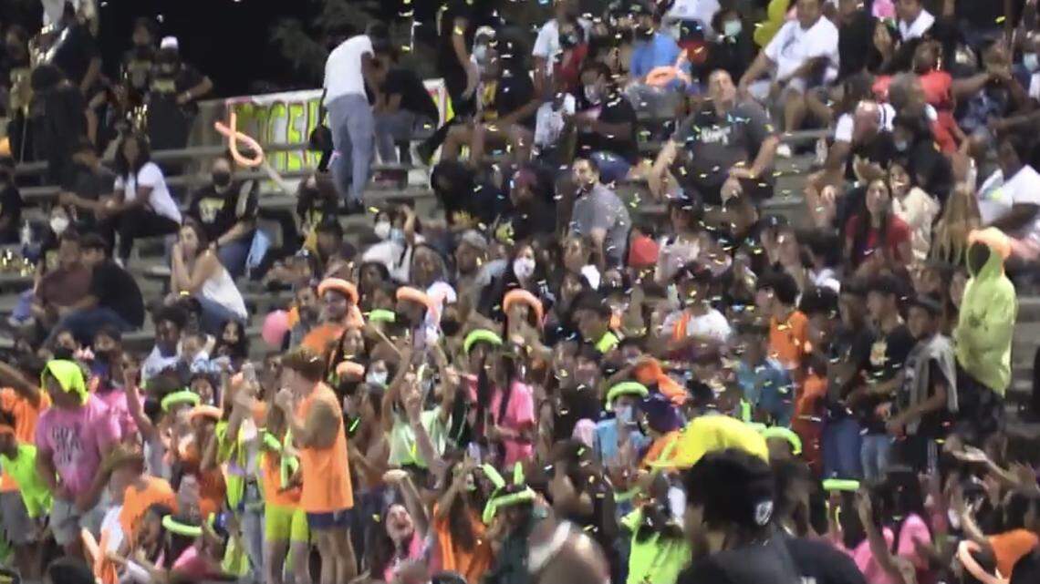 The Edison High student section celebrate a touchdown during the 2021 season.