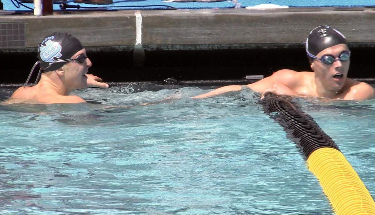 Hayden Lambert, right, and Ethan Linville, left, both of Clovis North finished 1 and 2, respectively in the 500 free at the Central Section Division I swimming championships at Clovis West on Saturday, May 6, 2023.