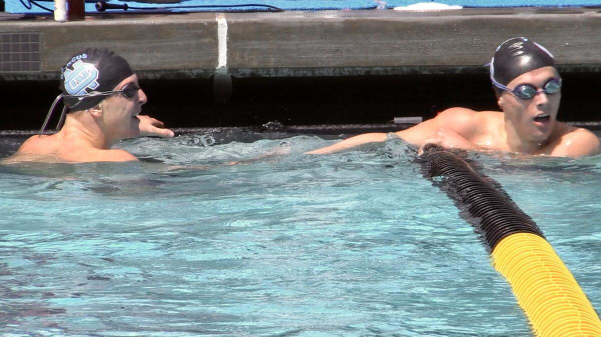 Hayden Lambert, right, and Ethan Linville, left, both of Clovis North finished 1 and 2, respectively in the 500 free at the Central Section Division I swimming championships at Clovis West on Saturday, May 6, 2023.