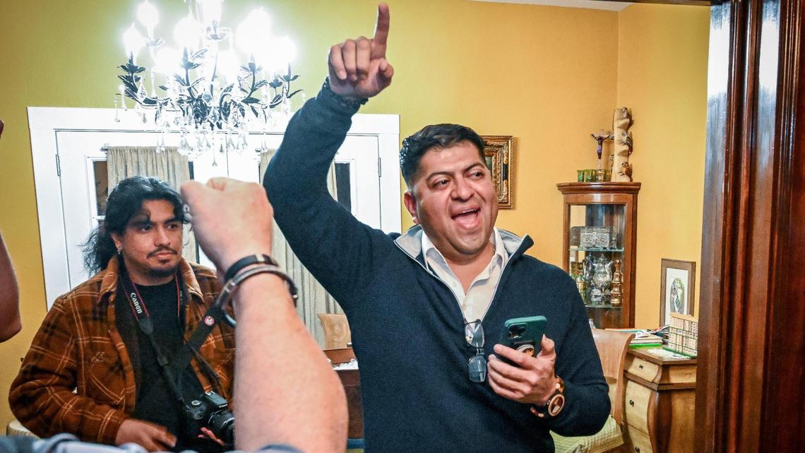 Luis Chavez, candidate for the District 3 seat on the Fresno County Board of Supervisors, raises his arm in a cheer after seeing election results showing him leading incumbent Supervisor Sal Quintero during an election watch party with supporters at Chavez’s home in Fresno on Tuesday, Nov. 5, 2024.