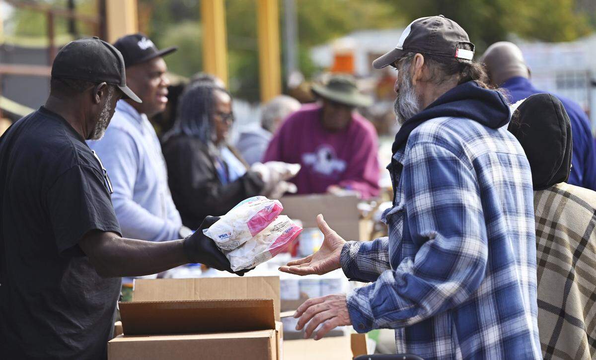 Frozen shrimp is handed out during a food bank event held at Saint Rest Baptist Church Thursday, Nov. 6, 2025 in West Fresno.