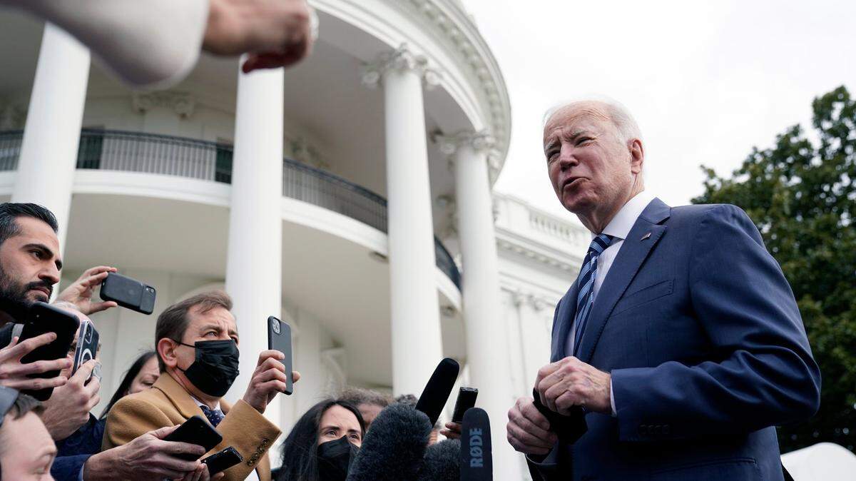 President Joe Biden speaks with members of the press before boarding Marine One on the South Lawn of the White House, Thursday, Feb. 17, 2022, in Washington.