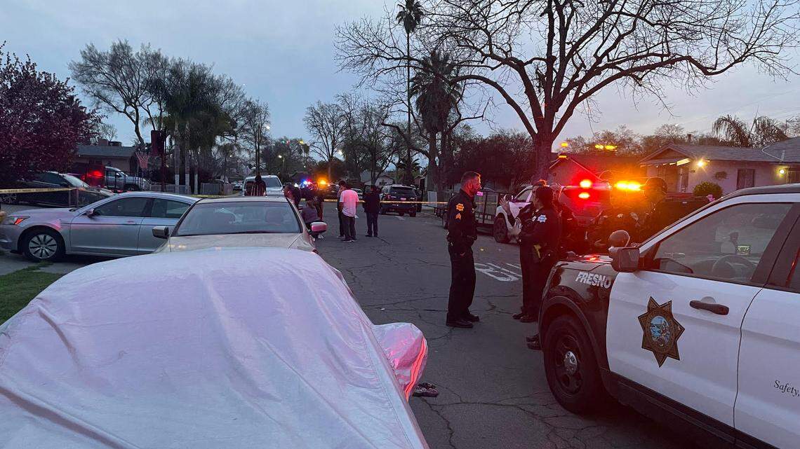 Officers surround a home in the 4700 block of East Hamilton Avenue, where an armed man reportedly fired on officers before taking his own life Monday night, according to Fresno police,