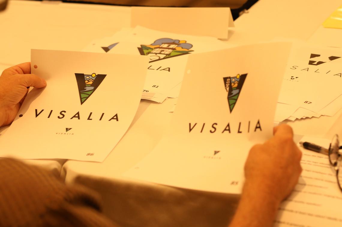 Visalia’s logo redesign committee members work on possible entries recommendations for the city council Monday night at the Visalia Convention Center.