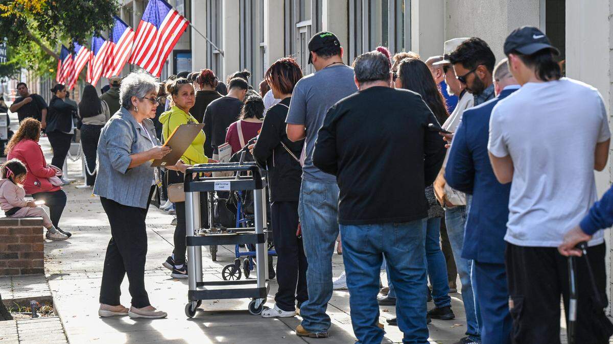 Voters wait in a long line outside the Fresno County Clerk/Registrar of Voters department in downtown Fresno on Election Day, Tuesday, Nov. 5, 2024.