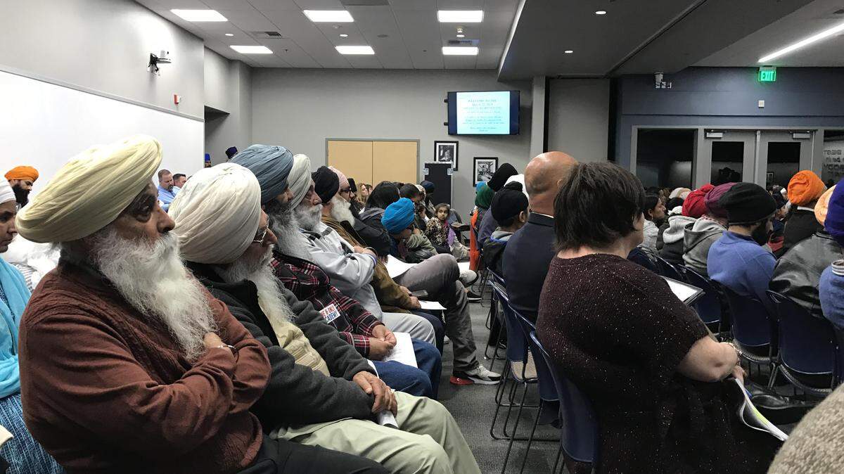 Attendees are shown at Wednesday's Clovis Unified board meeting, where a proposed charter school that would have taught in English and Punjabi was discussed.