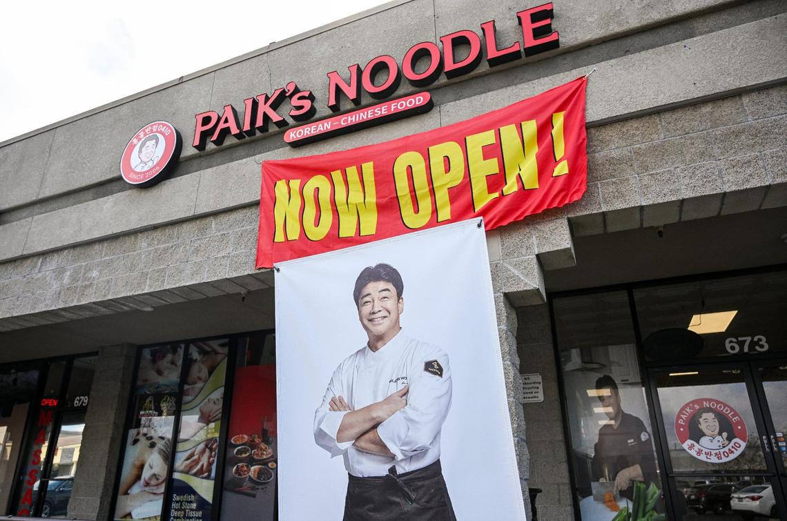 Chef Paik Jong-won is pictured on a banner outside Paik’s Noodle in the Save Mart shopping center at First and Nees in north Fresno. Paik is a television celebrity chef in South Korea and founder of the Paik’s Noodle chain of restaurants.