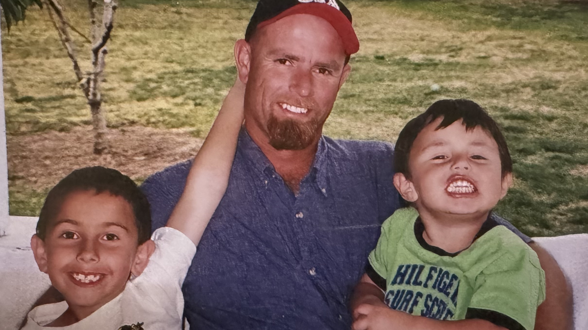 Robert Willis IV sits with his sons Robbie and Colton, left to right, in this undated file photo.