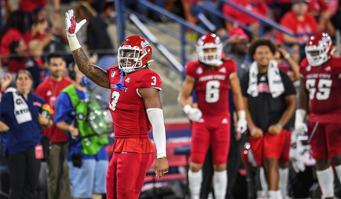 Fresno State’s Arron Mosby celebrates after sacking Nevada quarterback Carson Strong during their game at Bulldog Stadium on Saturday, Oct. 23, 2021.