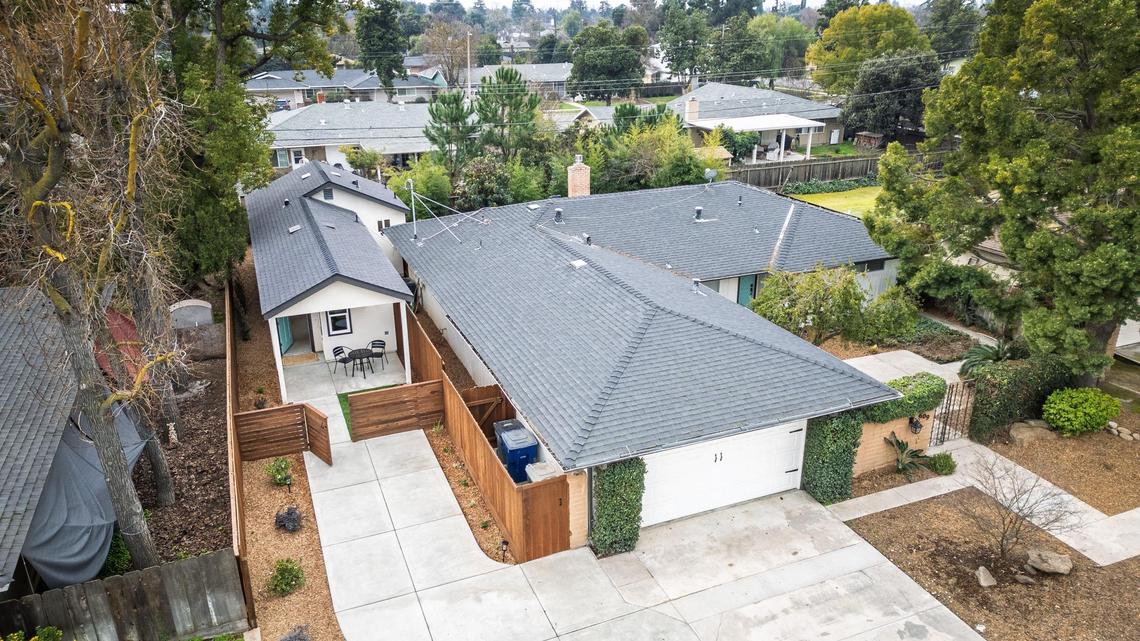 A recently finished accessory dwelling unit or ADU sits next to the main house on a lot in Fresno neighborhood. Property owner Brandon Telesmanic had the home built as a rental property which is a growing trend in Fresno.