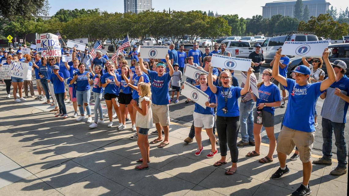 Hundreds of Immanuel schools students and supporters hold signs and gather outside B.F. Sisk courthouse in support of the schools’ decision to defy the countyÕs COVID-19 orders by opening its doors to in-person education, prior to a court hearing to decide if it can continue such instruction, on Tuesday, Aug. 25, 2020.