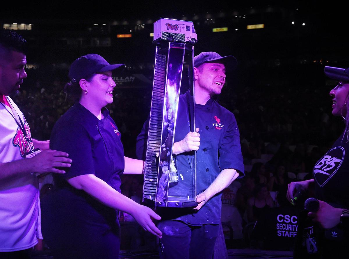 Maritza Silva, left, and her husband Luciano Morfin, hold the Judge’s Choice trophy they won at Taco Truck Throwdown 9, held at Chukchansi Park Saturday. Aug. 17, 2019 in Fresno.