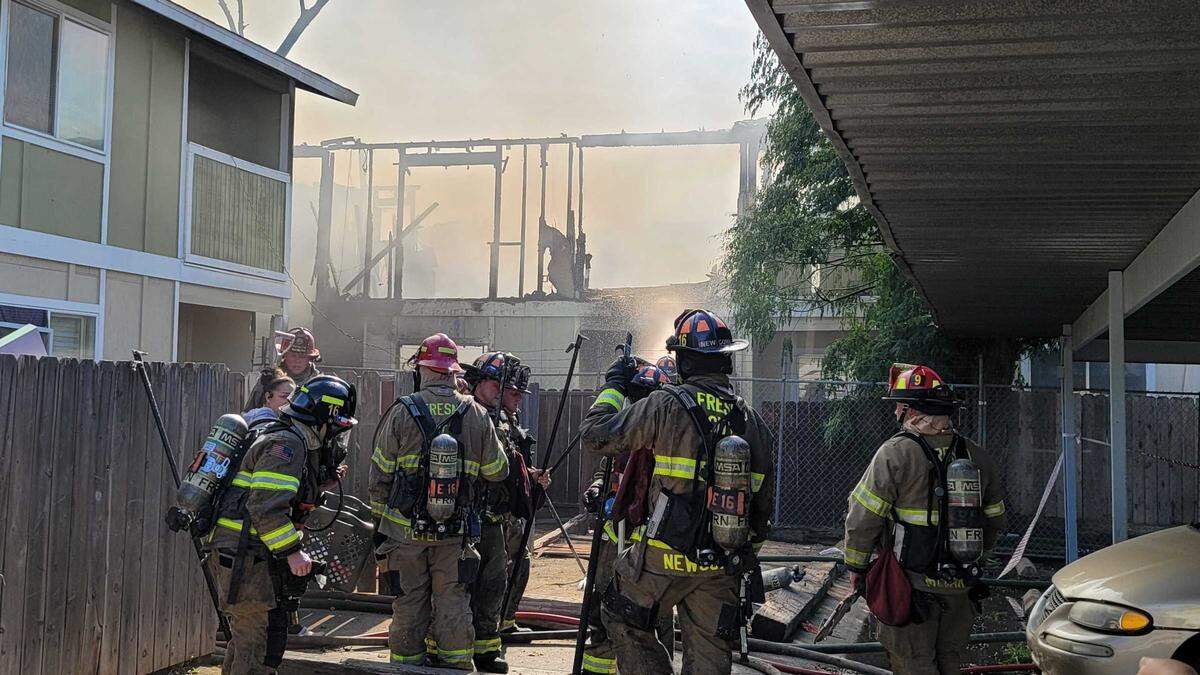 Fresno firefighters respond to a three-alarm apartment complex on Monday, May 16, 2022.