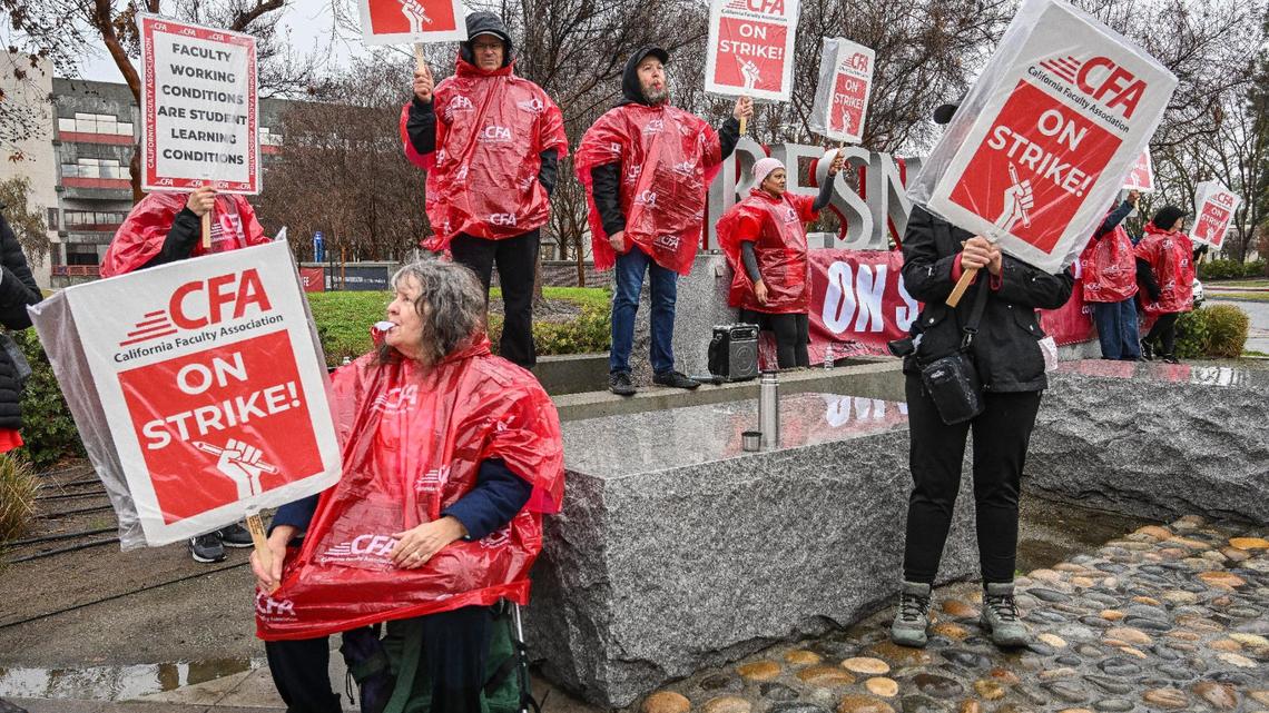 Fresno State faculty members picket and blow whistles in front of the university on the corner of Maple and Shaw avenues in Fresno on Monday, Jan. 22, 2024. The strike is planned for five days while faculty members call for higher pay.