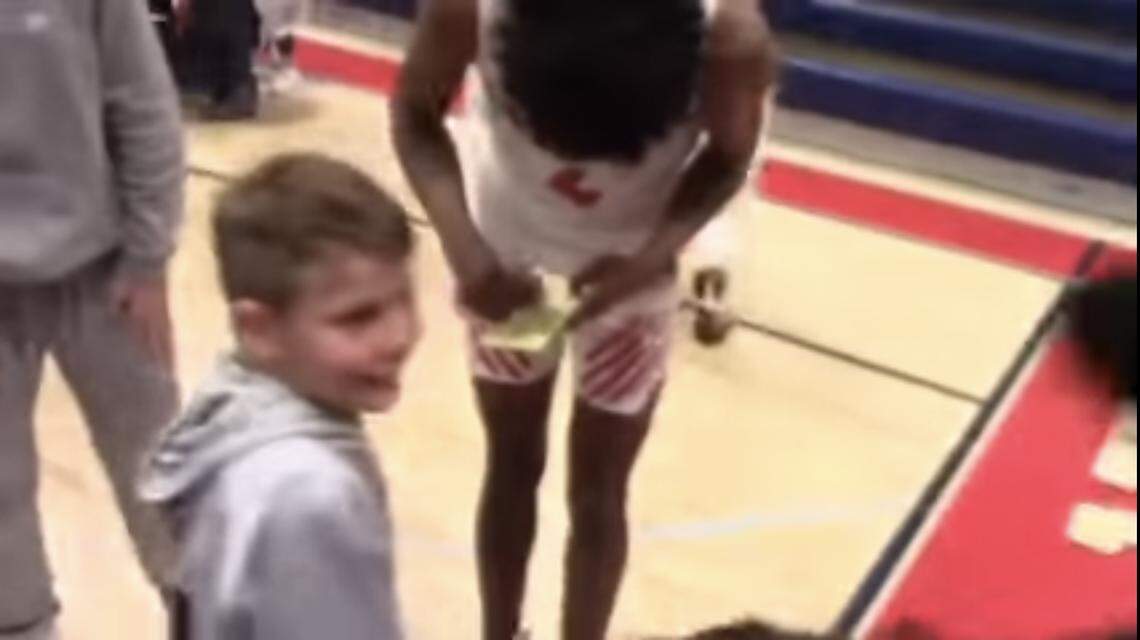 Jalen Green signs an autograph at a game in 2019.