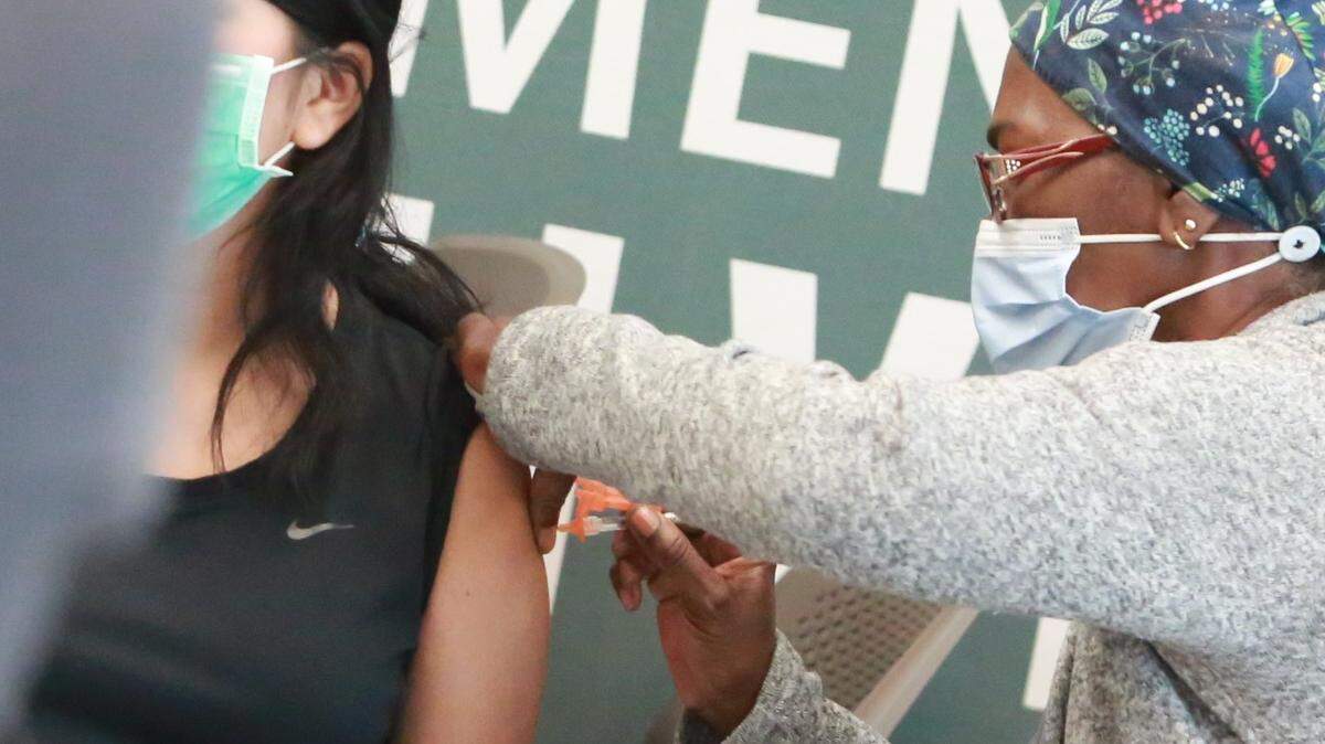 A Madera Community College student get one of the COVID vaccines during a clinic on campus Aug. 10. The college gave students a $150 gift card incentive to students.