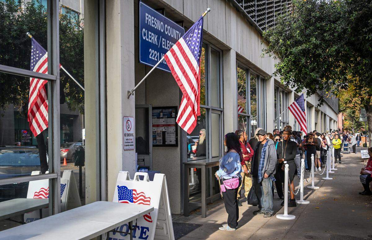 Voters wait in a long line outside the Fresno County Clerk/Registrar of Voters department in downtown Fresno on Election Day, Tuesday, Nov. 5, 2024.