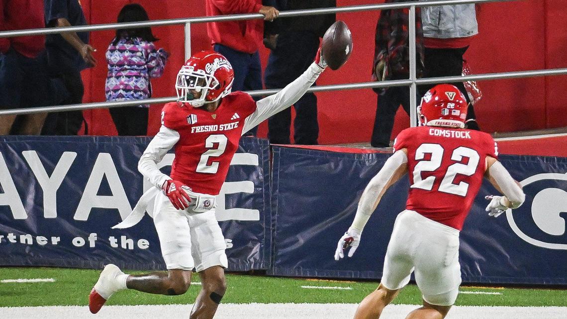Fresno State’s Carlton Johnson, left, celebrates with Steven Comstock after intercepting the ball against Nevada during their game at Valley Children’s Stadium on Saturday, Sept. 30, 2023.