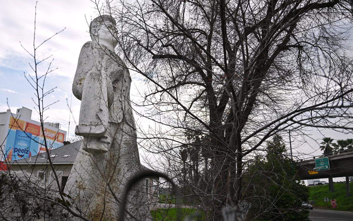 We take a look at two statues and their molds, one of David of Sassoon and another of John F. Kennedy, both stored in a backyard near freeways 41 and 180 near the warehouse district of Fresno, photographed Thursday, Jan. 22, 2026.