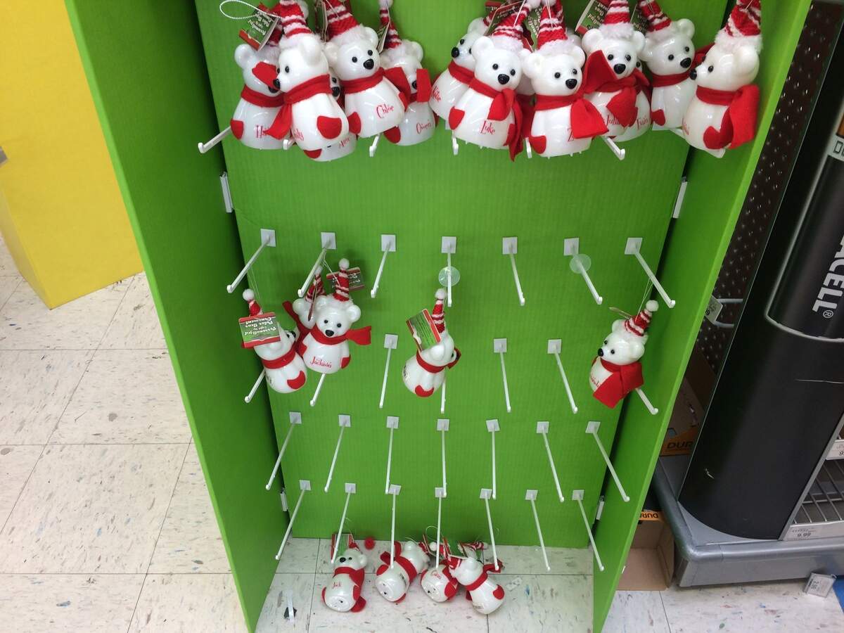 These Christmas ornaments, polar bears wearing scarves and hats and bearing children's names, have fallen to the floor near the checkout at the West Shaw Avenue Toys R Us during its going-out-of-business sale.