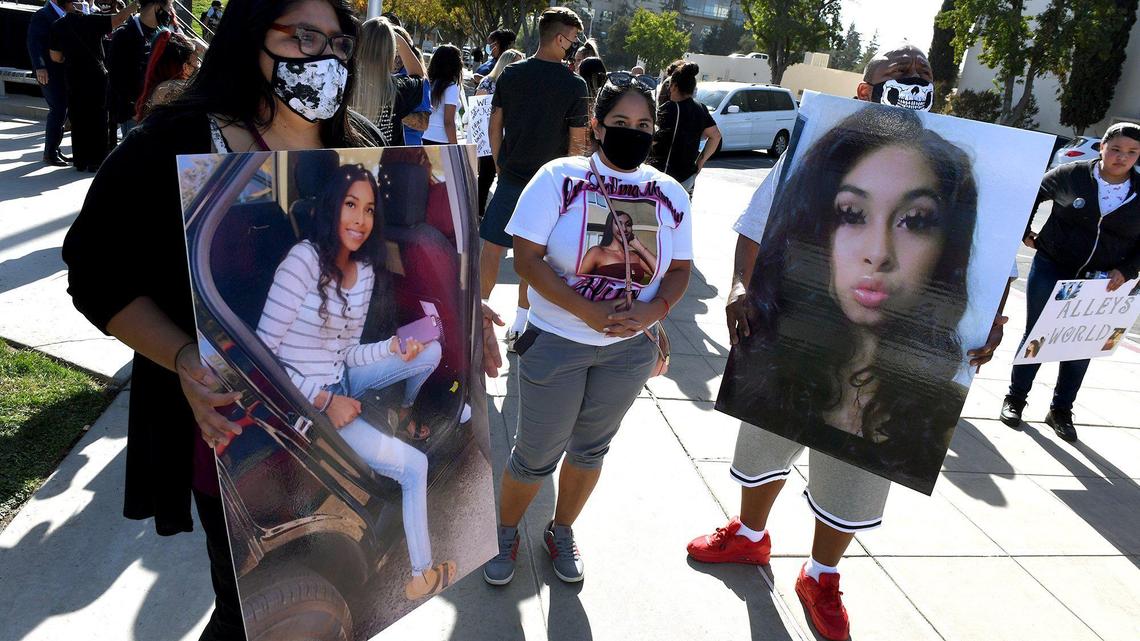 Family members of Alize Morales, who lost her life recently to gun violence, hold photos of her at a Save Our Children rally, Friday Oct. 23, 2020, to voice their outrage at the rash of recent shootings in Fresno and to call for justice for unsolved cases.