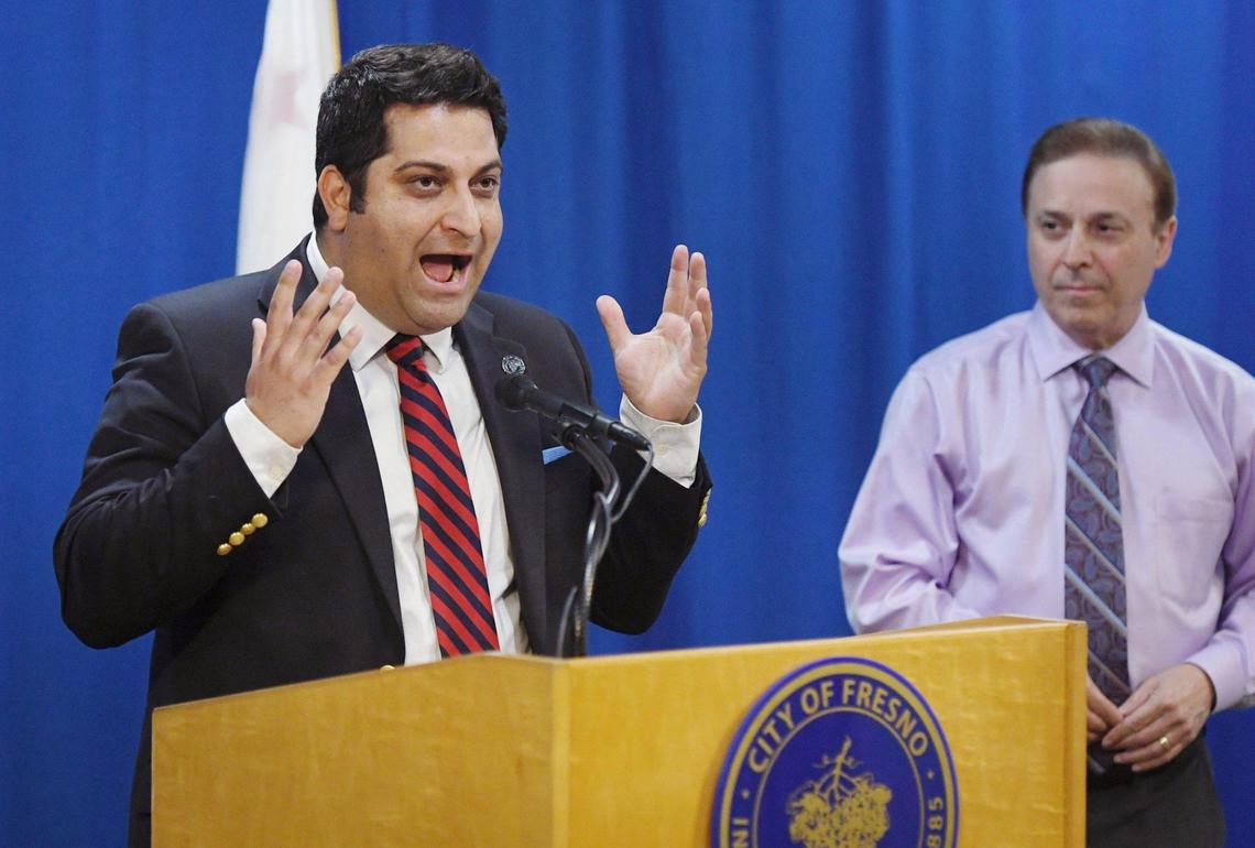 Fresno City councilperson Mike Karbassi, left, vents frustration as Garry Bredefeld stands to the right after the two said Terrance Frazier, operator of Granite Park, has continued to remain in default of his contract with the City of Fresno for insurance coverage for over a year at a news conference Wednesday, April 6, 2022 in Fresno.