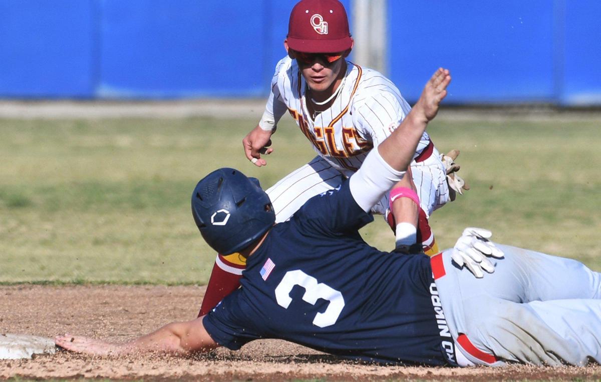 San Joaquin Memorial’s Mikey Bell, foreground, is out at second base covered by Clovis West’s Marc Anthony Carroll, background, in Coca Cola Classic baseball championship action Saturday, March 12, 2022 in Clovis. Clovis West ended the game defeating Memorial 9-2 in six innings for the championship.