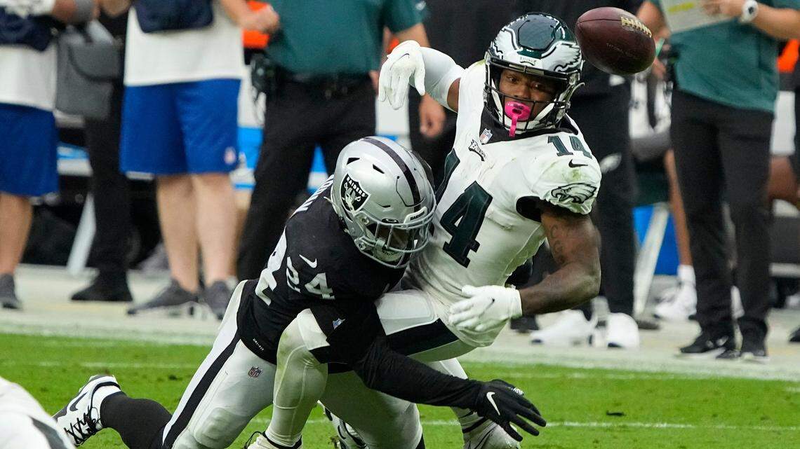 Philadelphia Eagles running back Kenneth Gainwell (14) and Las Vegas Raiders safety Johnathan Abram (24) during the second half of an NFL football game against the Las Vegas Raiders, Sunday, Oct. 24, 2021, in Las Vegas.