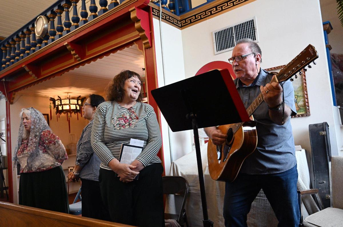 The choir performs during Mass at St. Genevieve Catholic Church in Chinatown, Sunday, Oct. 27, 2024, in Fresno.