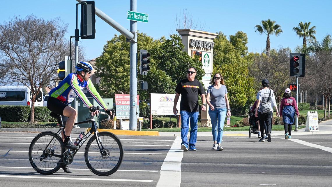 Do I have to wait for a pedestrian to fully cross the street before driving in WA state?