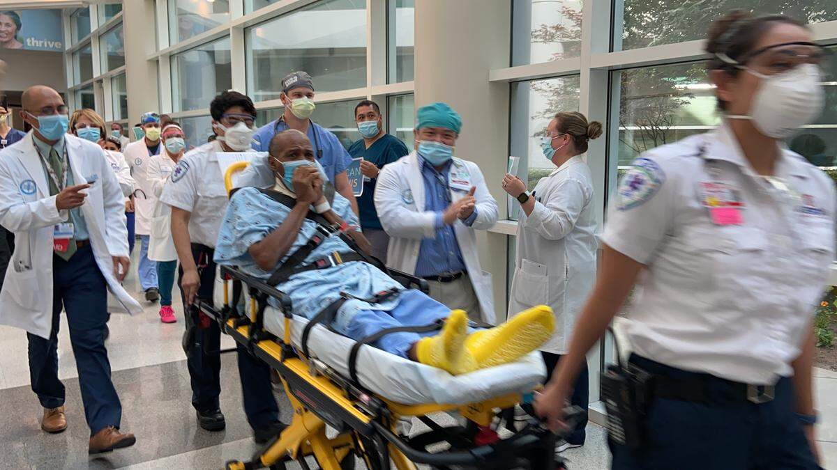 Ronald Hill being discharged from Kaiser Permanente Fresno in May after recovering from COVID-19.
