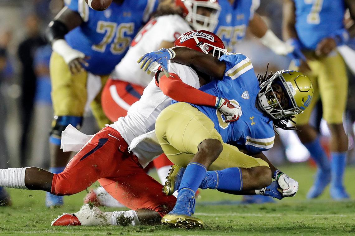 Fresno State safety Mike Bell takes down UCLA wide receiver Stephen Johnson III, right, during the Bulldogs’ 38-14 victory over the Bruins, Saturday, Sept. 15, 2018, in Pasadena. Bell has an interception in each of the Bulldogs’ past three games.
