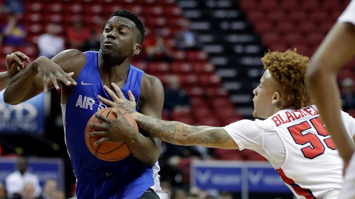 Air Force’s Ameka Akaya drives to the hoop as Fresno State’s Noah Blackwell defends during the first half of a Mountain West Conference tournament NCAA college basketball game Wednesday, March 4, 2020, in Las Vegas. (AP Photo/Isaac Brekken)