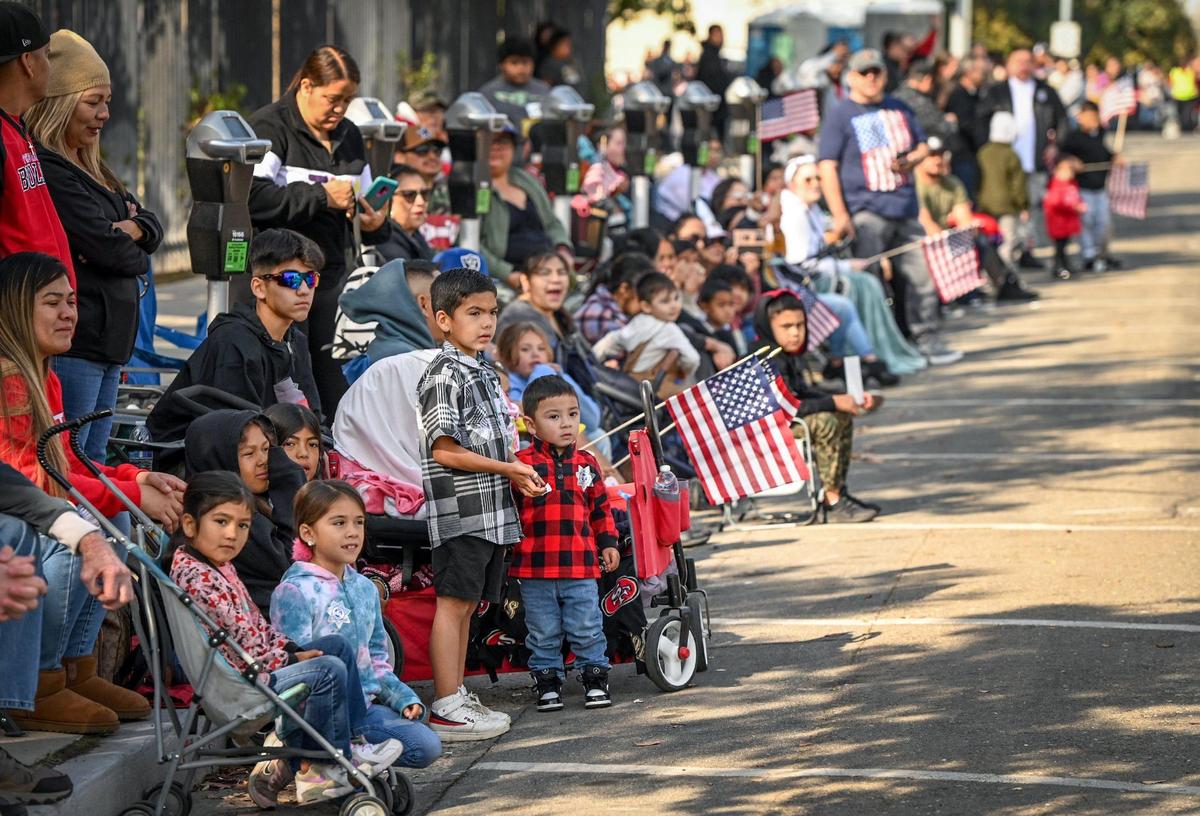 Crowds of people line the route during the annual Veterans Parade in downtown Fresno on Friday, Nov. 11, 2022.