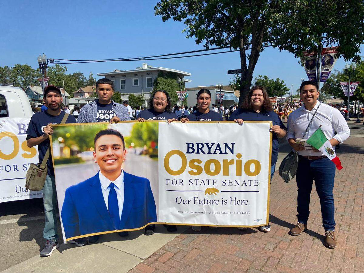 Delano’s mayor Bryan Osorio, right, is one of the candidates in the California’s State Senate District 16 race. He participated in Porterville’s Cinco De Mayo parade on April 30 in downtown Porterville.