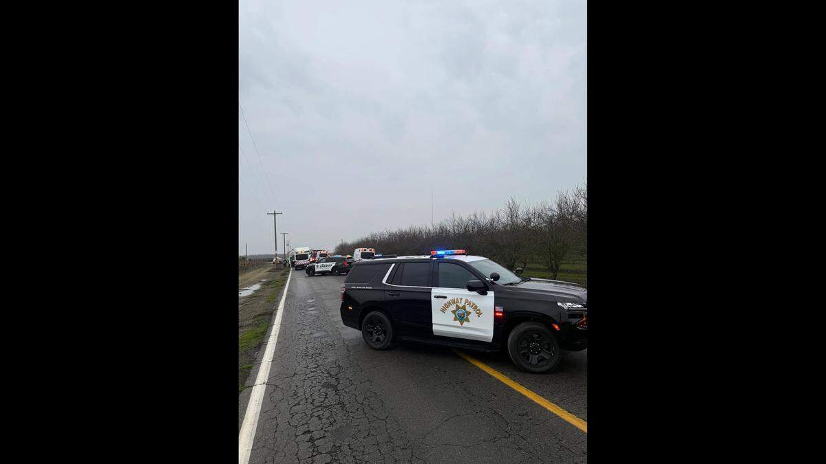 California Highway Patrol at the scene of a deadly crash between a Honda CR-V and a semi-truck Wednesday, Dec. 31, 2025, at the intersection of Road 23 and Avenue 13 in Madera County.