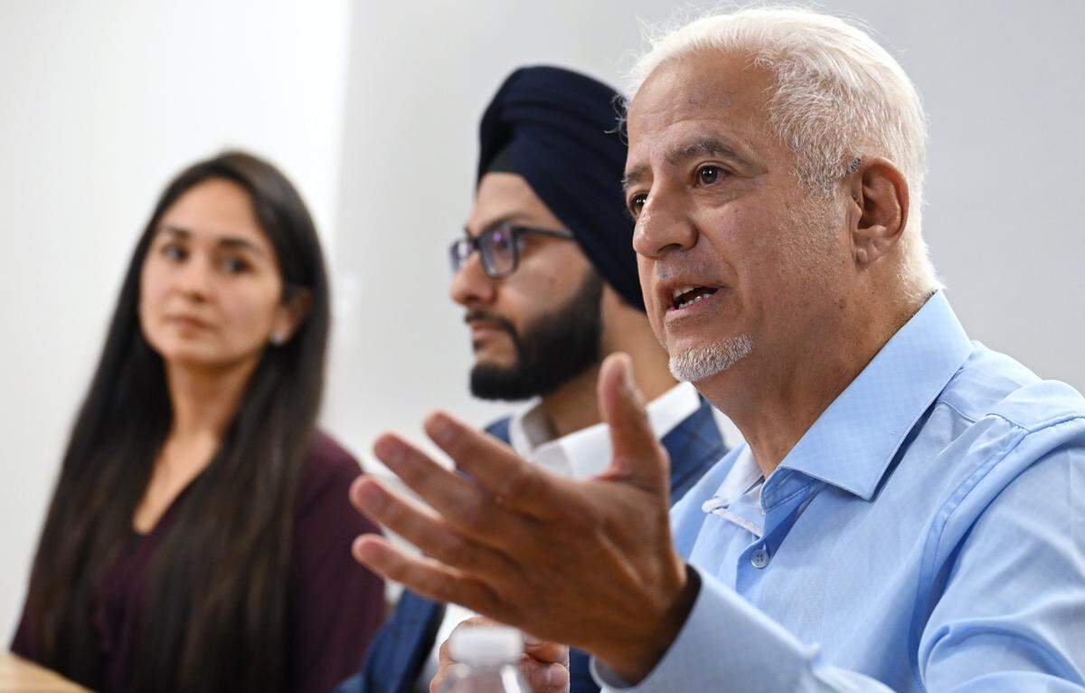 Dictrict 7 candidate AJ Rassamni, right, answers a question during a Fresno City Council District 7 forum held by The Fresno Bee Friday, April 17, 2026 in downtown Fresno