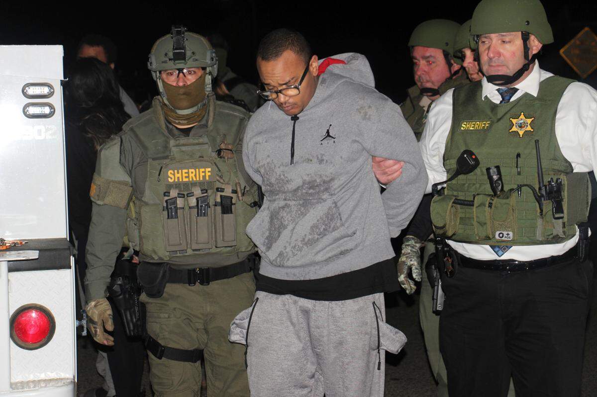 In this photo provided by the Tulare County Sheriff’s Office, Tulare Sheriff’s deputies take known gang member Noah David Beard into custody. Tulare County Sheriff Mike Boudreaux said Friday, Feb. 3, 2023, that Beard was taken into custody without incident and that Angel “Nanu” Uriarte was wounded in a shootout with federal agents. (Tulare County Sheriff’s Office via AP)
