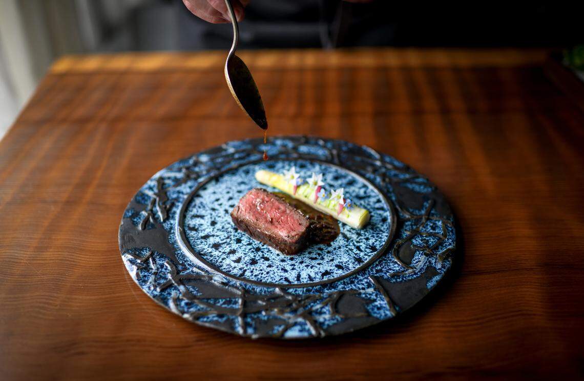 This 32-day dry-aged rib eye, with white asparagus and abalone xo sauce is an example of a dish at Aubergine, a restaurant with two Michelin stars in Carmel.