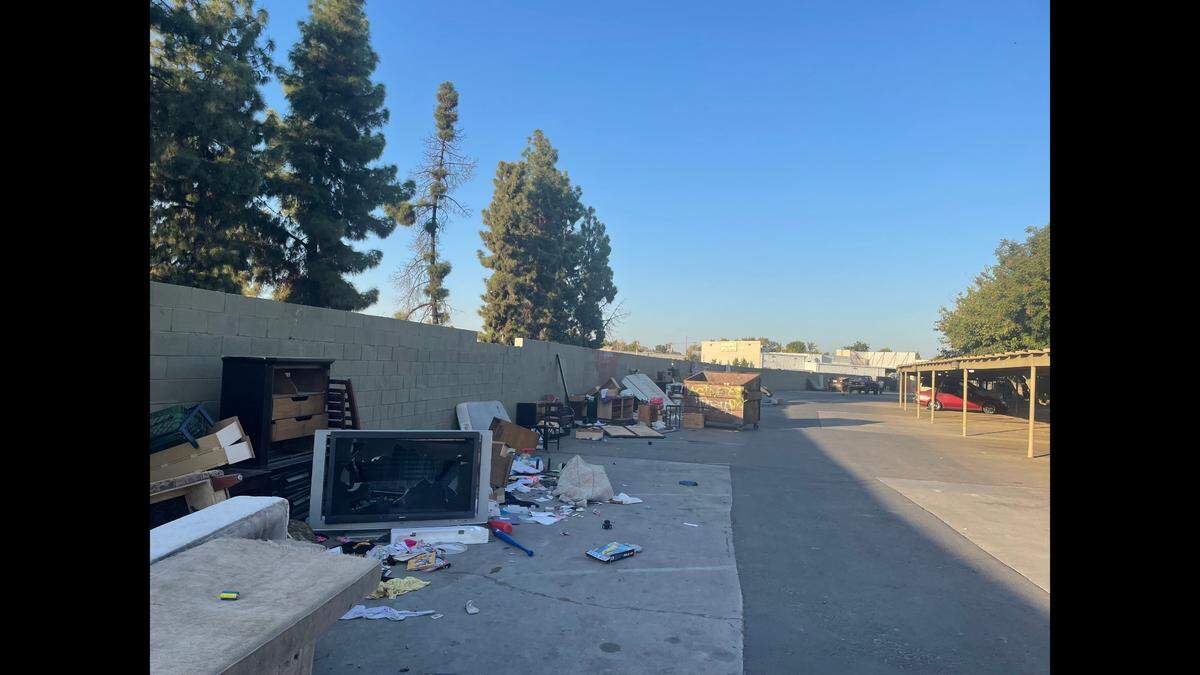 Some residents at The Reserved Apartment Homes at First and Tulare streets were left with their belongings in the parking lot Friday, although they had not found a new place to live after new owners evicted the tenants.