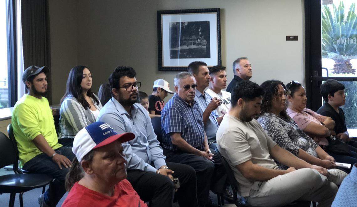 Owners and supporters of the Tacos El Guerrero and Plátano, Pupusas Y Cafecito food trailers sit together at the Chowchilla City Council meeting Oct. 10, when they commented that the city’s $100-a-day fee is unfair to Latino businesses. Nitesh Kunwar, seen behind the woman wearing the baseball cap, was the sole person to warn against allowing too many food trucks in town.