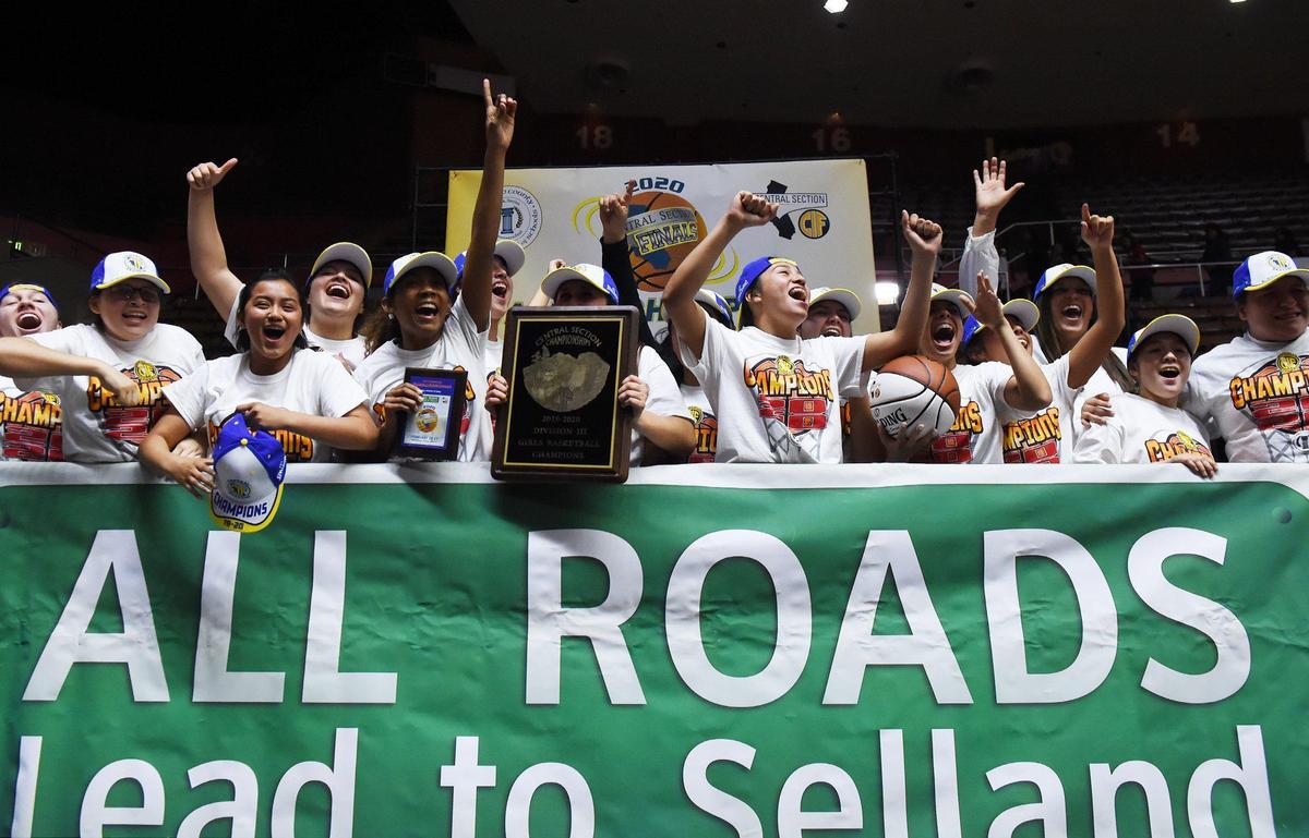 Porterville girls celebrate their 65-39 win against Arvin in the Central Section Division III girls basketball championship held at Selland Arena Friday, Feb. 28, 2020 in Fresno.