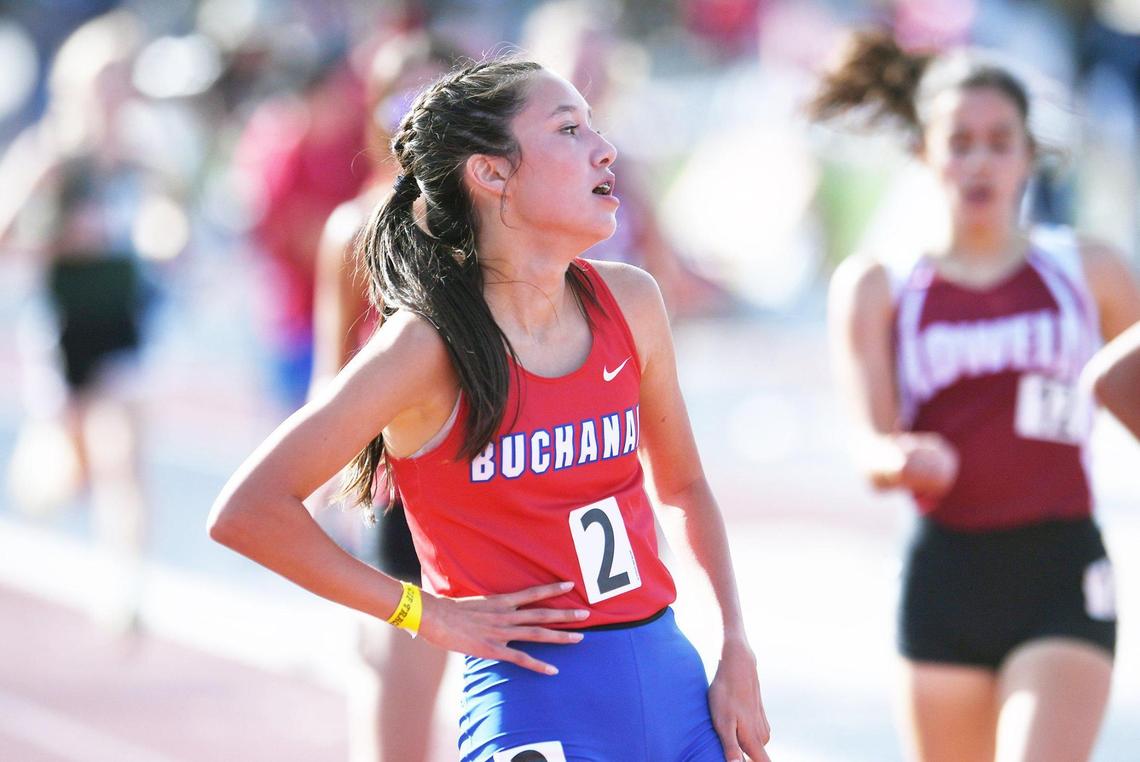 Buchanan’s Sierra Cornett, center, relaxes after she placed in fourth place in the first heat of theGirls 1600 M Run at the CIF State Track and Field Championships Friday, May 27, 2022 in Clovis.
