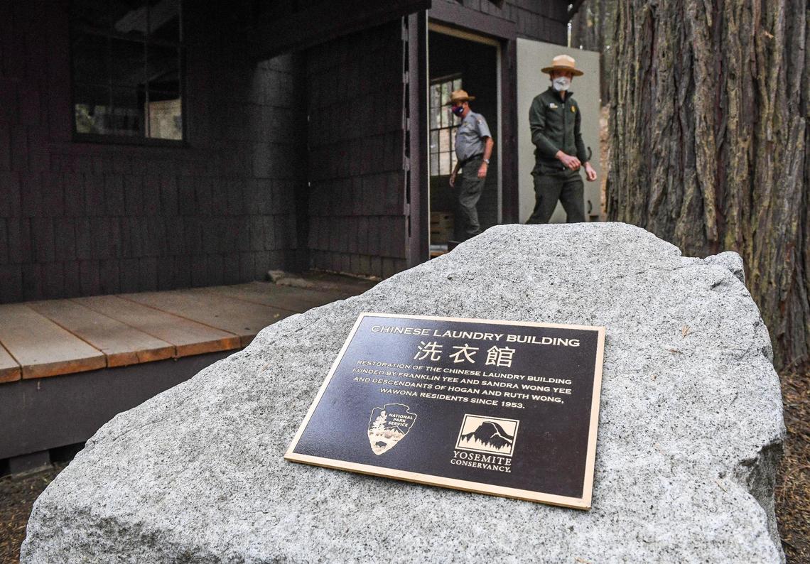A plaque marks the location of the Chinese Laundry Building near the Yosemite History Center in Yosemite’s Wawona on Tuesday, Sept. 28, 2021. The building is being dedicated in honor of its original purpose as a laundry building for the Wawona Hotel and the Chinese immigrants who ran it.