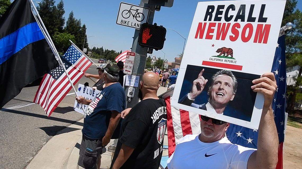 Around 75 protesters at Shepherd and Cedar avenues promote a recall of California Gov. Gavin Newsom and support President Donald Trump on Saturday July 18, 2020. The event was sponsored by the Fresno County California Republican Assembly.
