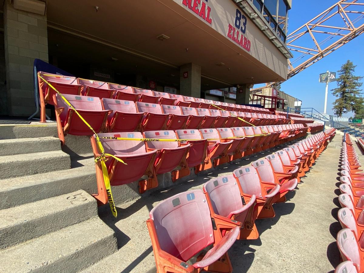 A section of seats at Valley Children’s Stadium is taped off. Shards of glass from a window broken by a Bulldogs’ assistant during a Homecoming victory over San Jose State landed in the section, injuring a number of fans.
