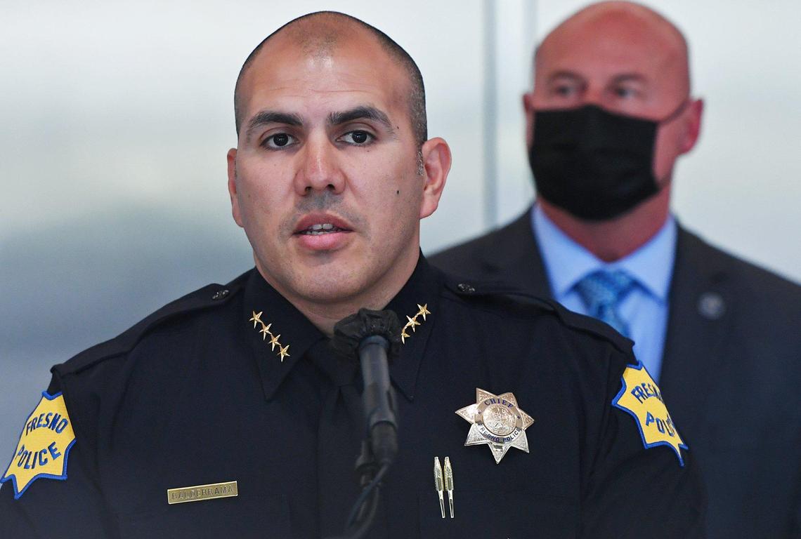 Fresno Police Chief Paco Balderrama, left, with Fresno Mayor Jerry Dyer to the right, announces new monitoring policies for police presence at Tower Theatre protests during a press conference Wednesday, April 14, 2021 in Fresno.