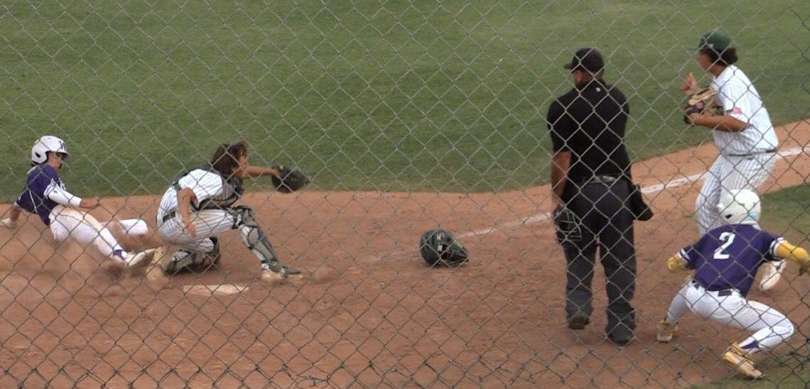 Davin Finderup of Washington Union slides home against Kingsburg in a Central Section Division II semifinal game. He was called out.