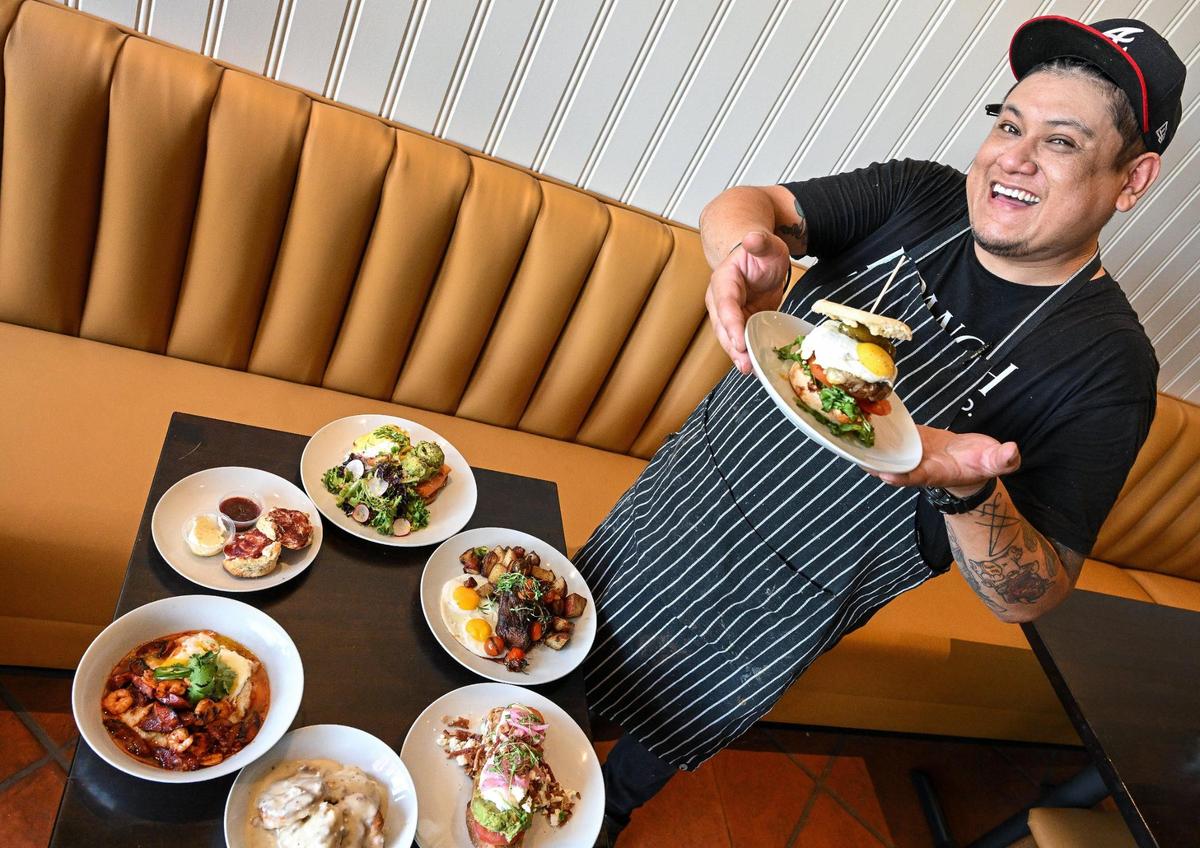 Julio Monroy, chef at Branch Breakfast Co. shows off a Branch Burger from a few of the favorites on the menu at the new breakfast restaurant in Fresno.